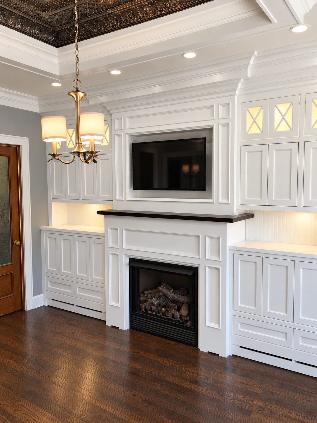 Custom white wall unit with shelving around a fireplace
