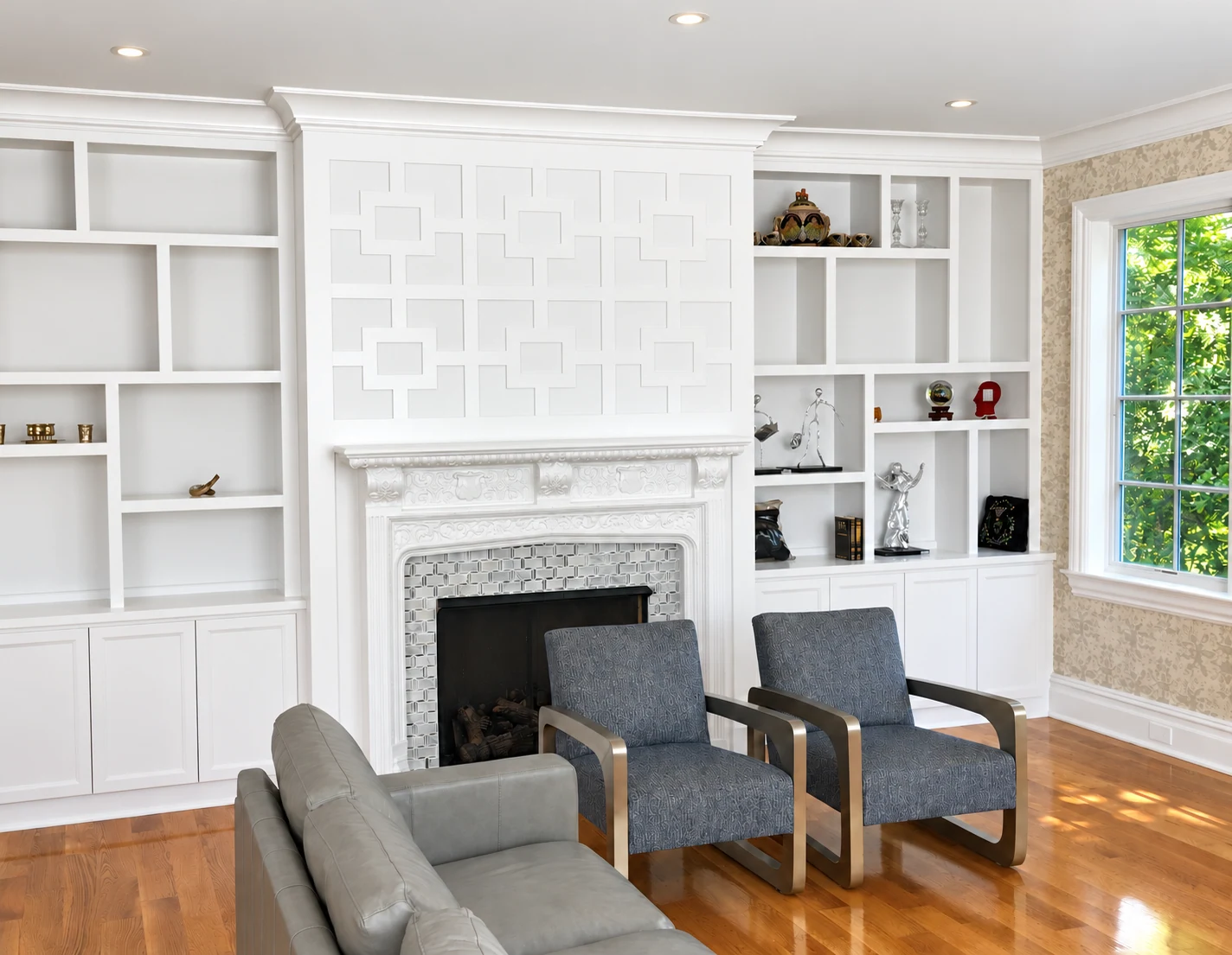 White geometric fireplace wall with open built-in shelves