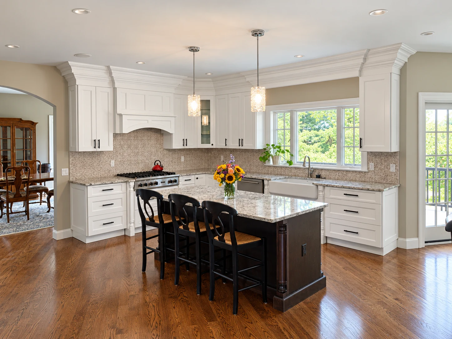 White kitchen with a contrasting dark island